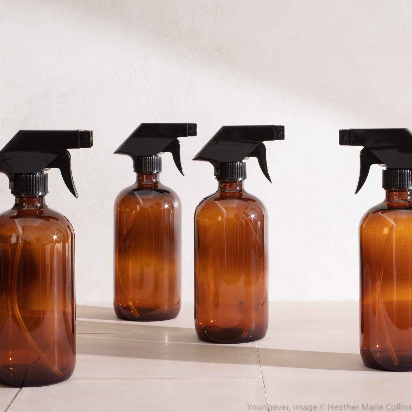 Youngever 4 Pack 16 Ounce Empty Glass Spray Bottles, Refillable Container for Essential Oils, Cleaning Products, or Aromatherapy, Trigger Sprayer with Mist and Stream Settings (Amber)