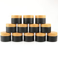 12 Pack 50gram/1.7oz Glass Cream Jars Empty Frosted Sample Containers Refillable Cosmetic Jar Vials with Plastic Wood Grain Lid&Inner Liner for Lotion Face Cream Moisturiser Gel Ointment - Black