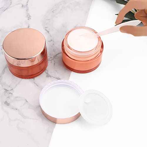Cositina 12 Pack 1oz Pink Glass Jars,Empty Round Storage Travel Containers with Rose-Golden Lids & Inner Liners,Refillable Cosmetic Vials for Moisturizer,Creams,Salve, Lotion