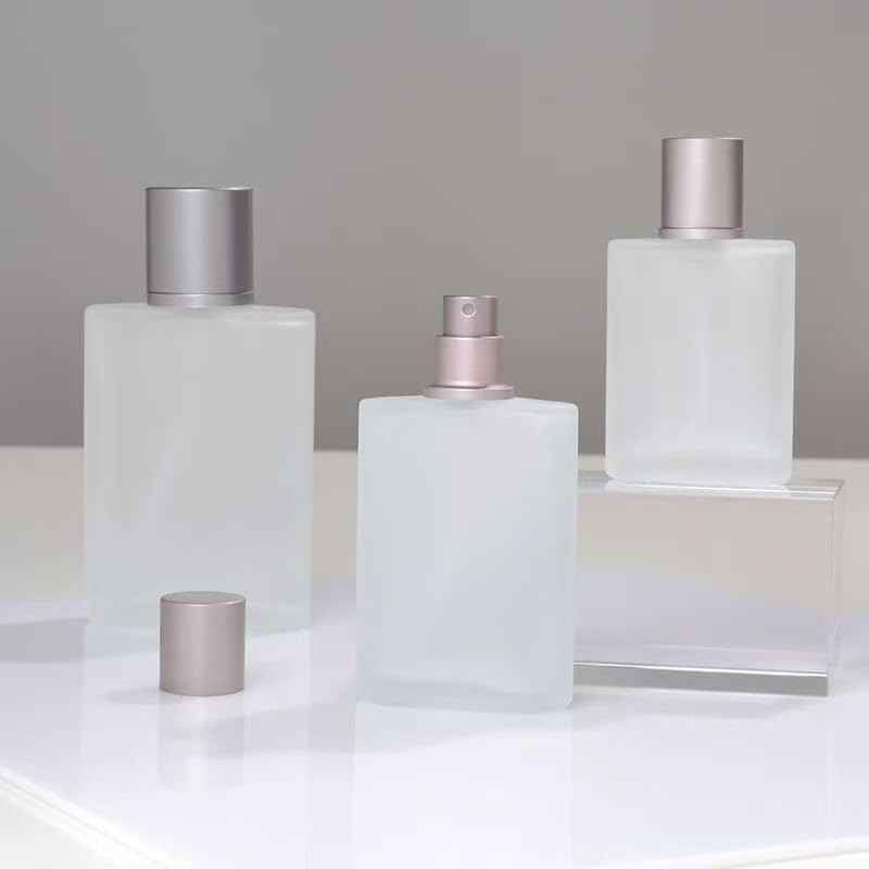 JJKMALL 100ML 3.4OZ Refillable Spray Perfume Bottles large cosmetic Fine Mist Atomizer Empty Frosted Clear Glass Essential Oil Container for Travel Makeup Party Refill tool