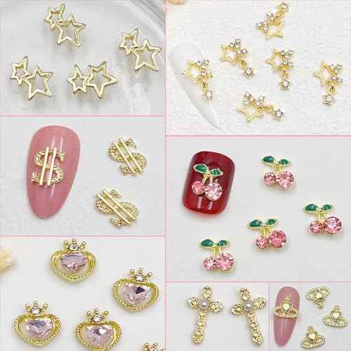 106 PCS Gold Nail Charms 3D Nail Art Charms Cherry Butterfly Cross Bow Star Heart Dollar 3D Nail Gems for Women Nail Art DIY Design
