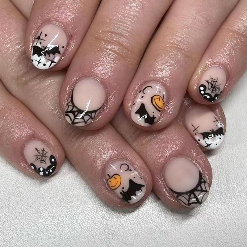 24Pcs Halloween Press on Nails Short Almond Black Fake Nails Full Cover Cute Pumpkin Spider Web False Nails with Bat Star Moon Designs Artificial Acrylic Nails Glossy Glue on Nails for Women Girls