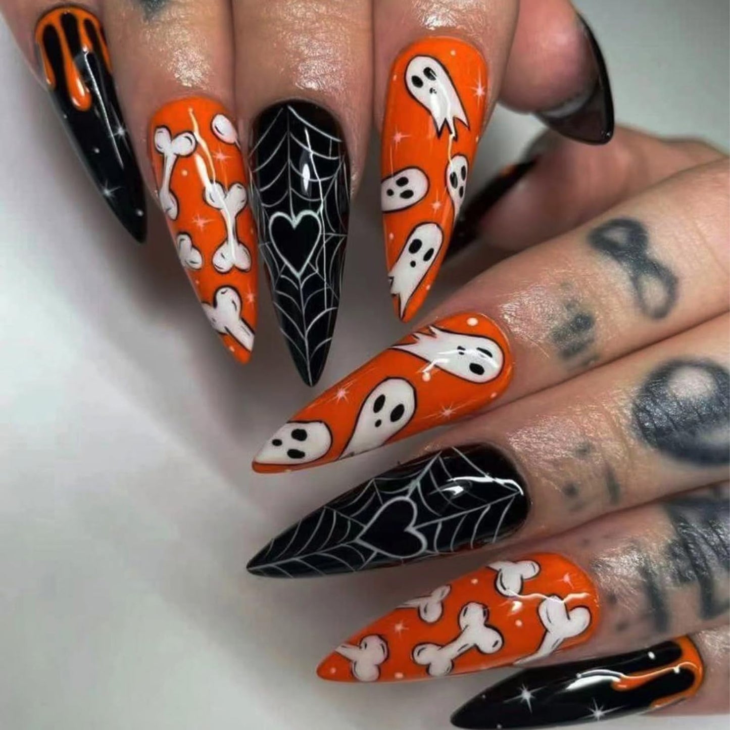 24 Pcs Halloween Press on Nails Long Stiletto Nail Tips with Cute Bone Spider Web Designs Ghost Fake Nails Orange Acrylic Nails Glossy Glue on Nails Halloween Nails for Women Girl