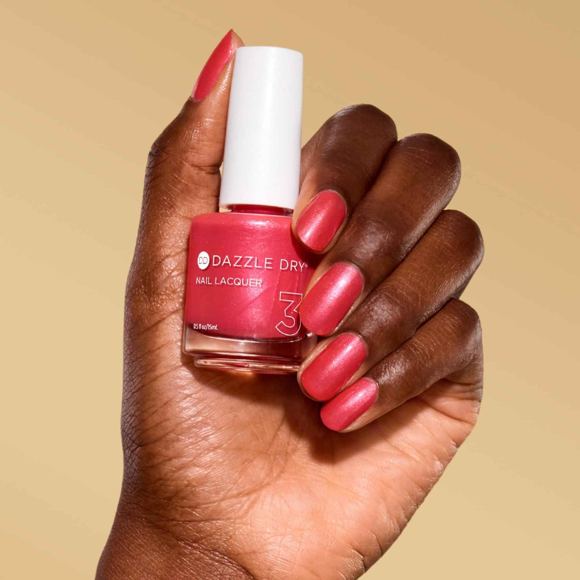 Dazzle Dry Nail Lacquer (Step 3) - Poolside Pink - A deep coral pink-red. Semi-sheer shimmer. (0.5 fl oz)