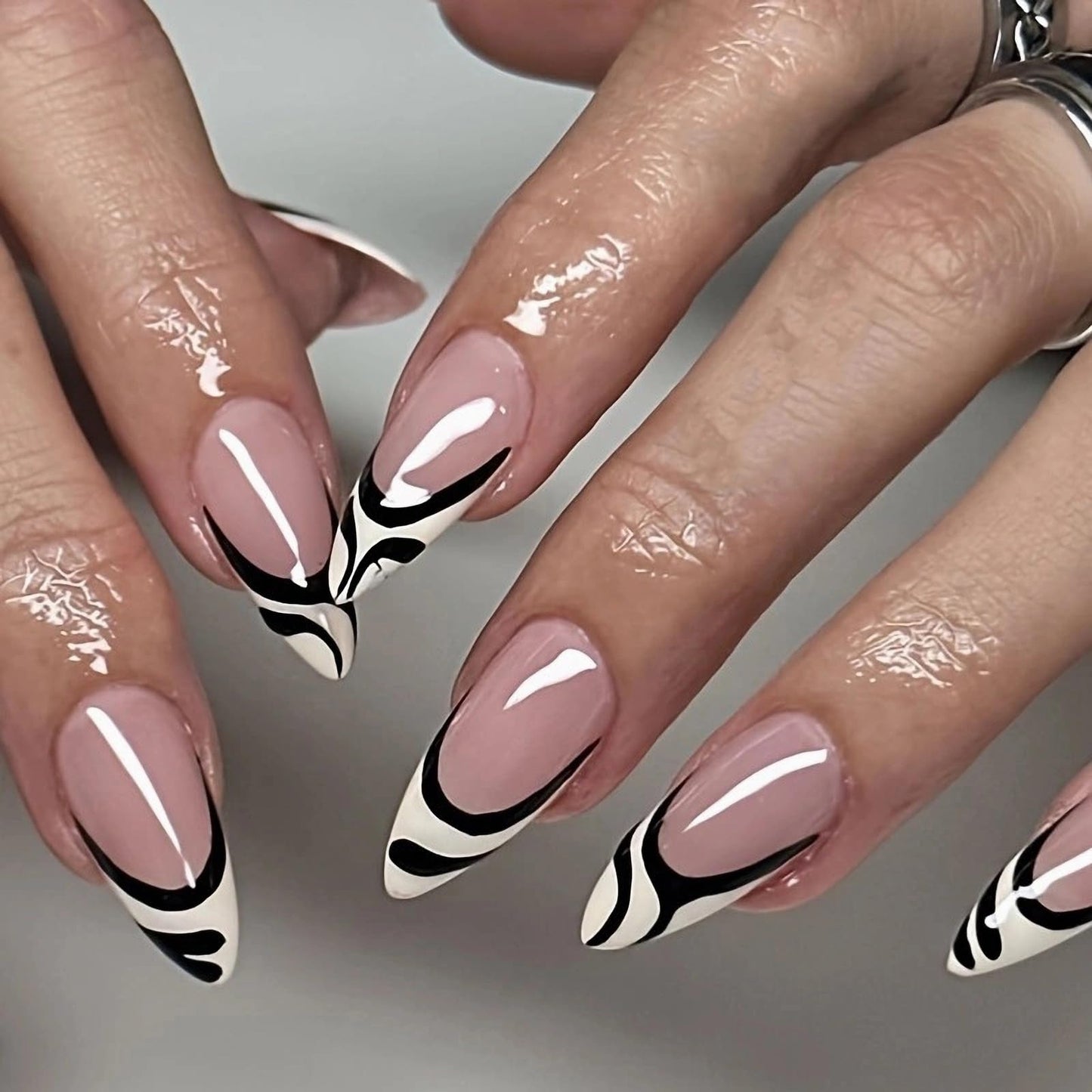 MISUD Press on Nails Medium Almond Fake Nails Glossy Glue on Nails Black White Swirl Acrylic Nails Stiletto Artificial Nails French Tip Stick on False Nails with Design 24 pcs