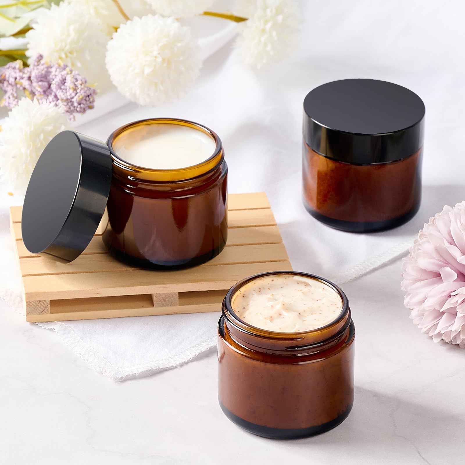Qeirudu 2 Oz Small Amber Glass Jars with Black Lids, 24 Pack Airtight Cosmetic Jars with Inner Liners Round Empty Sample Containers for Lotions, Creams, Candles, Body Butters, Essential oil