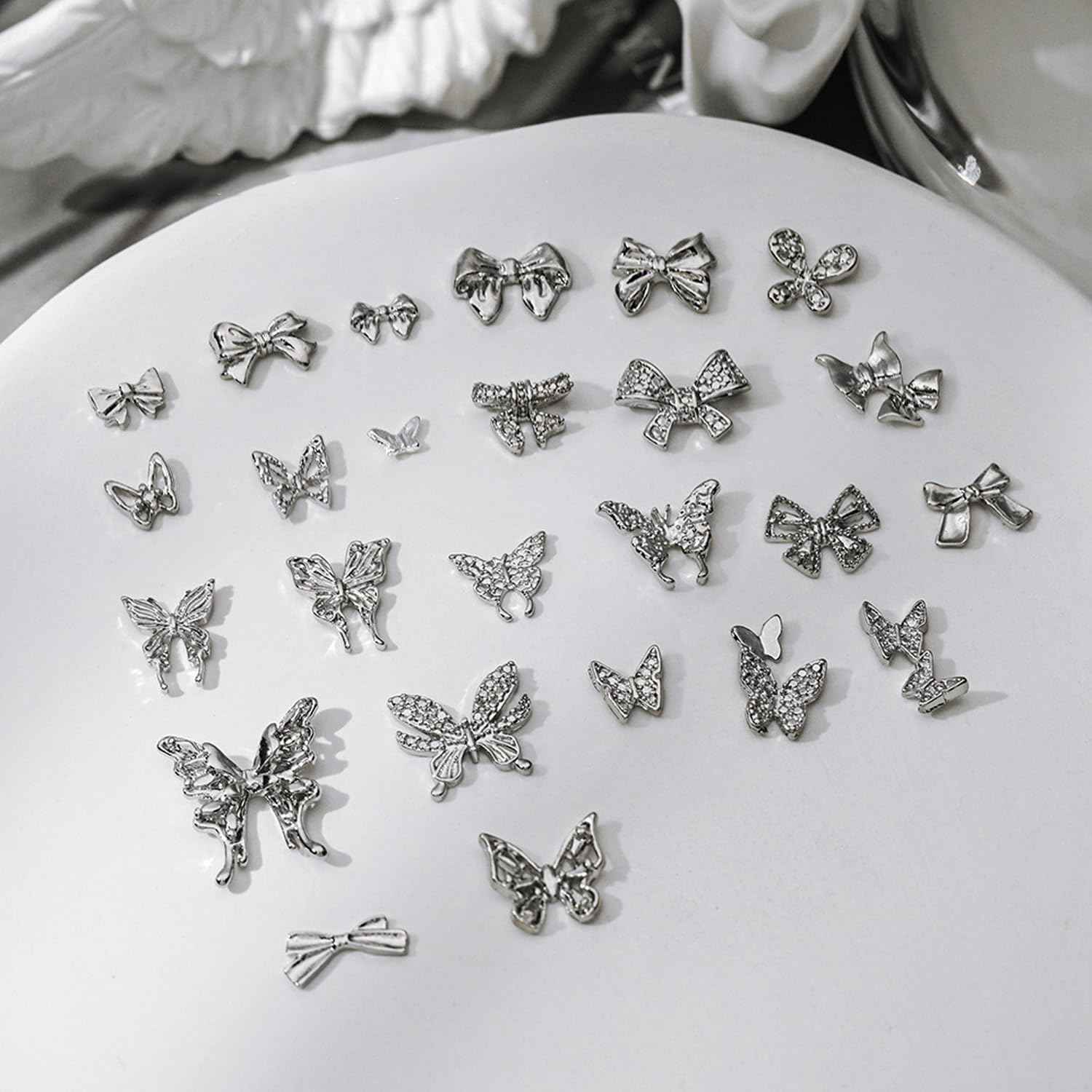 WOKOTO 100 Pcs 25 Styles Silver 3D Butterfly and Bow Nail Charms Alloy Nail Gems for Nails Butterfly Bow Knots Charms for Nail Art Design Decoration Jewelry Nail Alloy Studs Jewels