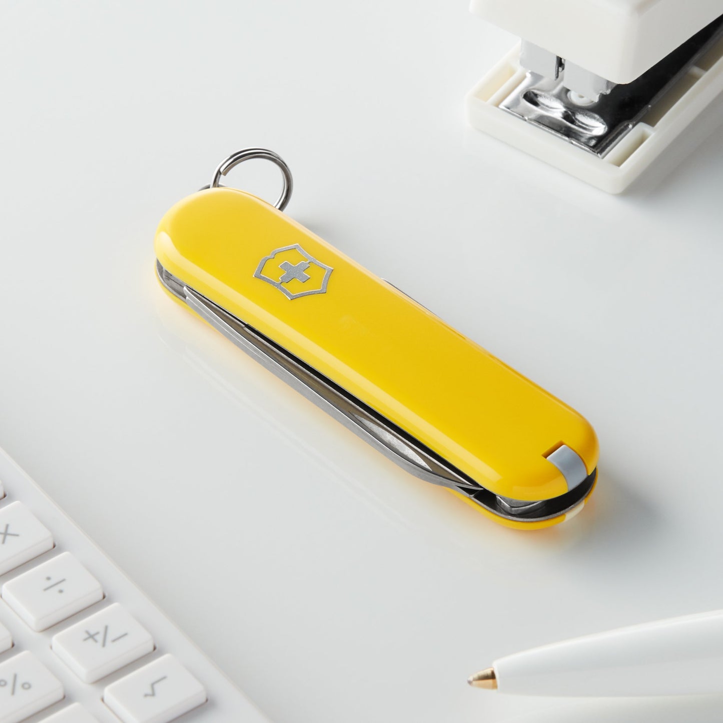 Victorinox Classic SD Swiss Army Knife, Compact, 7 Functions, Swiss Made Pocket Knife with Small Blade, Screwdriver and Key Ring - Sunny Side (Yellow)