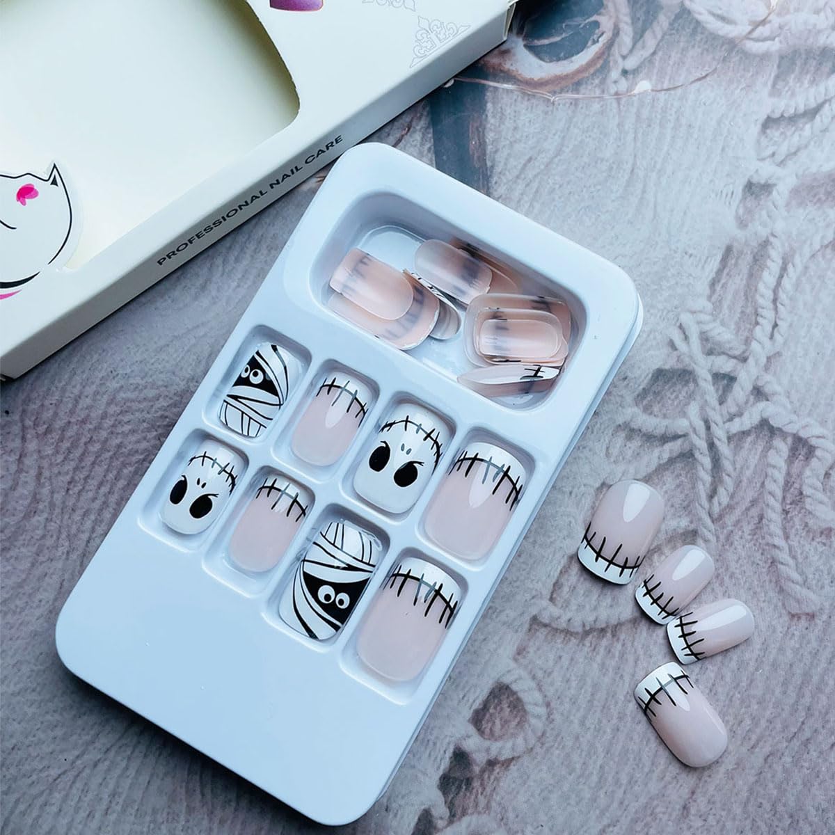 NEWSPIED Halloween Press on Nails Short Square Fake Nails White French Tip Acrylic Nails with Mummy Skull Design Cute Glue on Nails Halloween Nails Press on Full Cover False Nails for Women 24Pcs