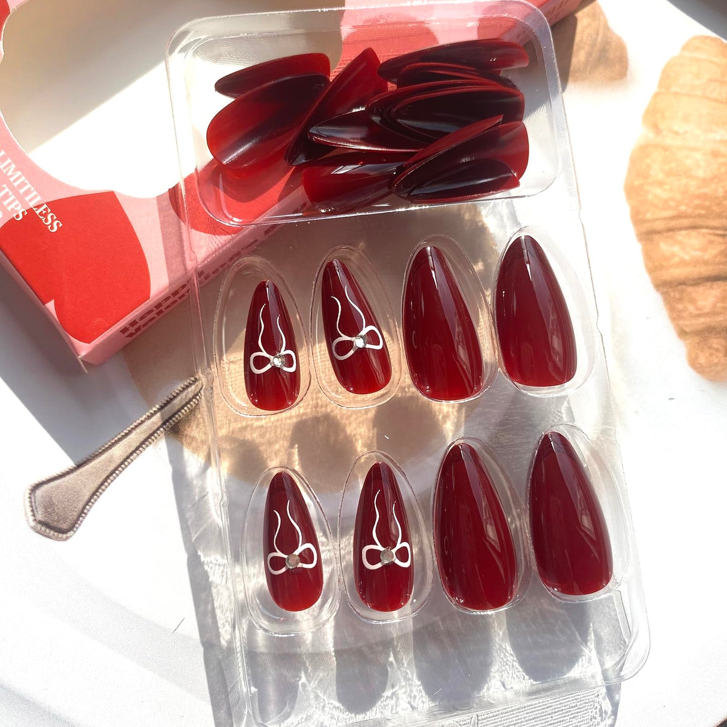 Burgundy Press on Nails Medium Almond - UCCASA Winter Almond Fake Nails Press ons Solid Color with Bow Design Full Cover False Nails Glue on Nails Stick on Nails Artificial Acrylic Nail Art Kit 24 Pcs