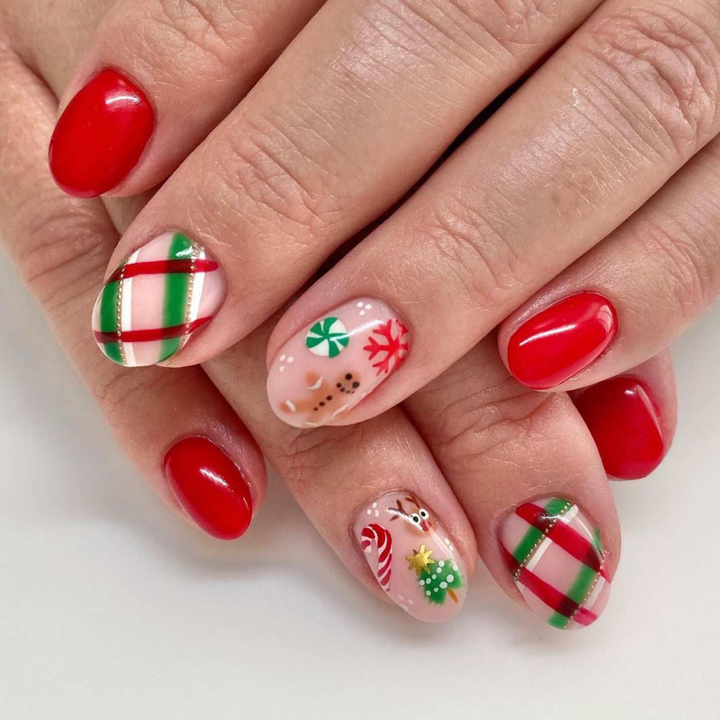 Christmas Red Nails Press on Nails Short Oval Fake Nails with Designs Gingerbread Man Candy Canes Snowflake Reindeer Stripe Full Cover Acrylic Square Nude Winter False Nails for Women and Girls 24Pcs