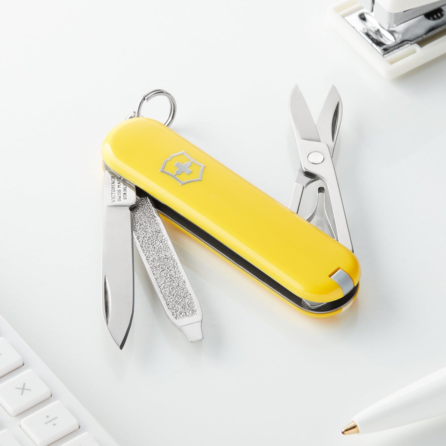 Victorinox Classic SD Swiss Army Knife, Compact, 7 Functions, Swiss Made Pocket Knife with Small Blade, Screwdriver and Key Ring - Sunny Side (Yellow)