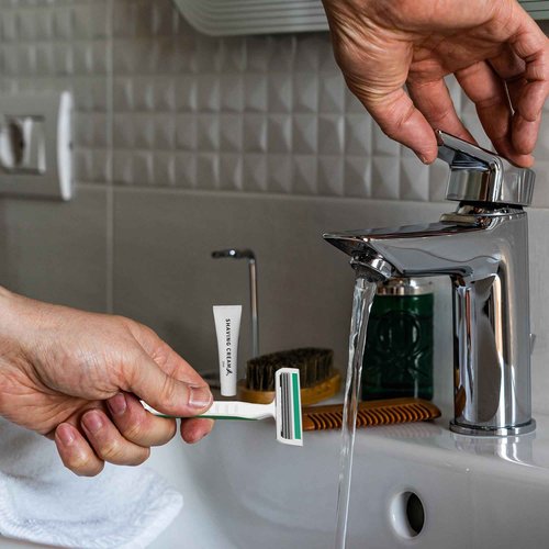 50 Pack Shave kit in Bulk 3 Blades Shave Disposable Razor with Protective Cap 12g Cream Individually Wrapped Paper Box for Hotel,Airbnb, Homeless,Shelter Camping Travel On The Go