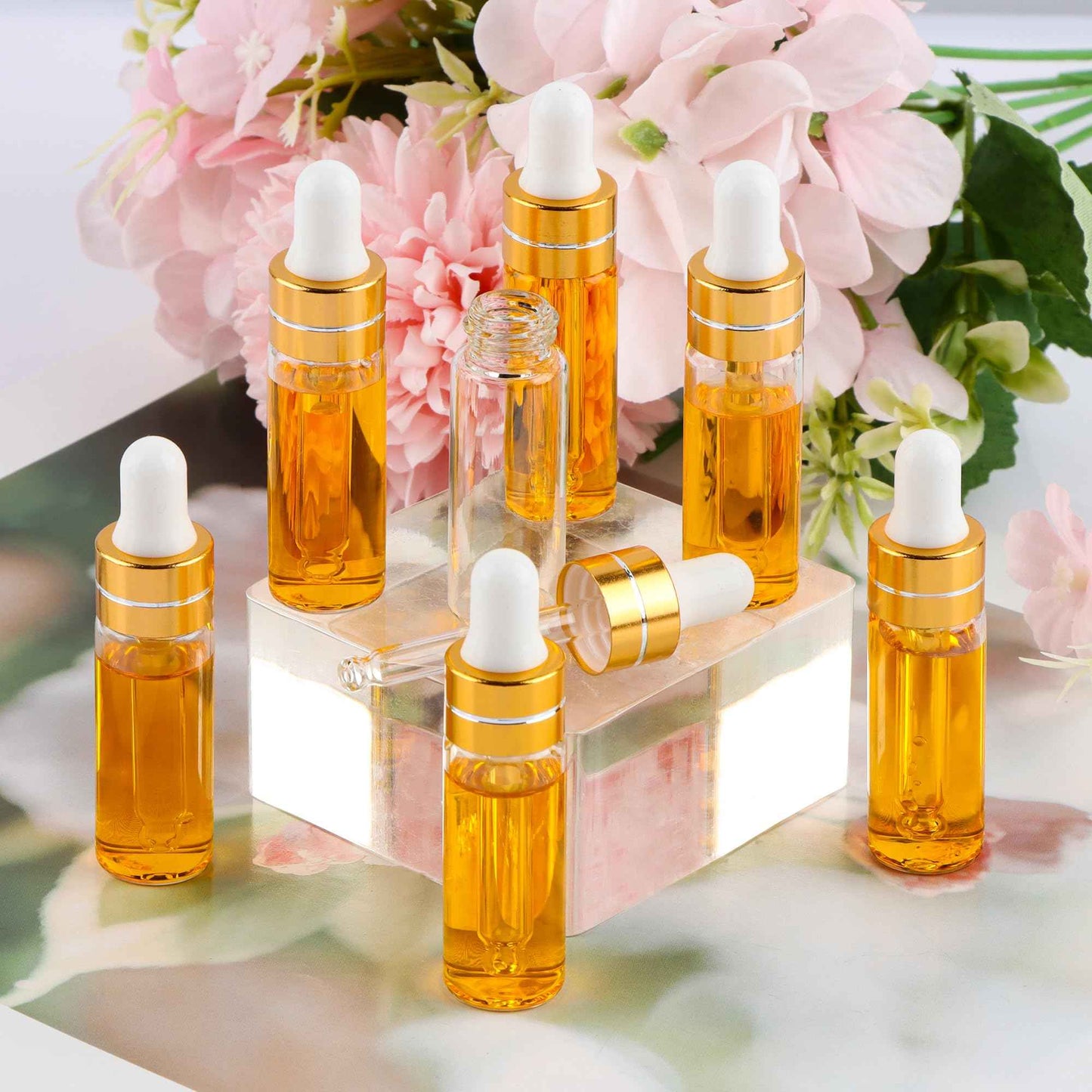 Comrzor 100 Pack 5ml Clear Glass Dropper Bottles with 4 Pcs Plastic Droppers, Mini Sample Dropper Bottles for Essential Oils Perfume Cosmetic Liquid, Empty Travel Sample Vials with Gold Cap