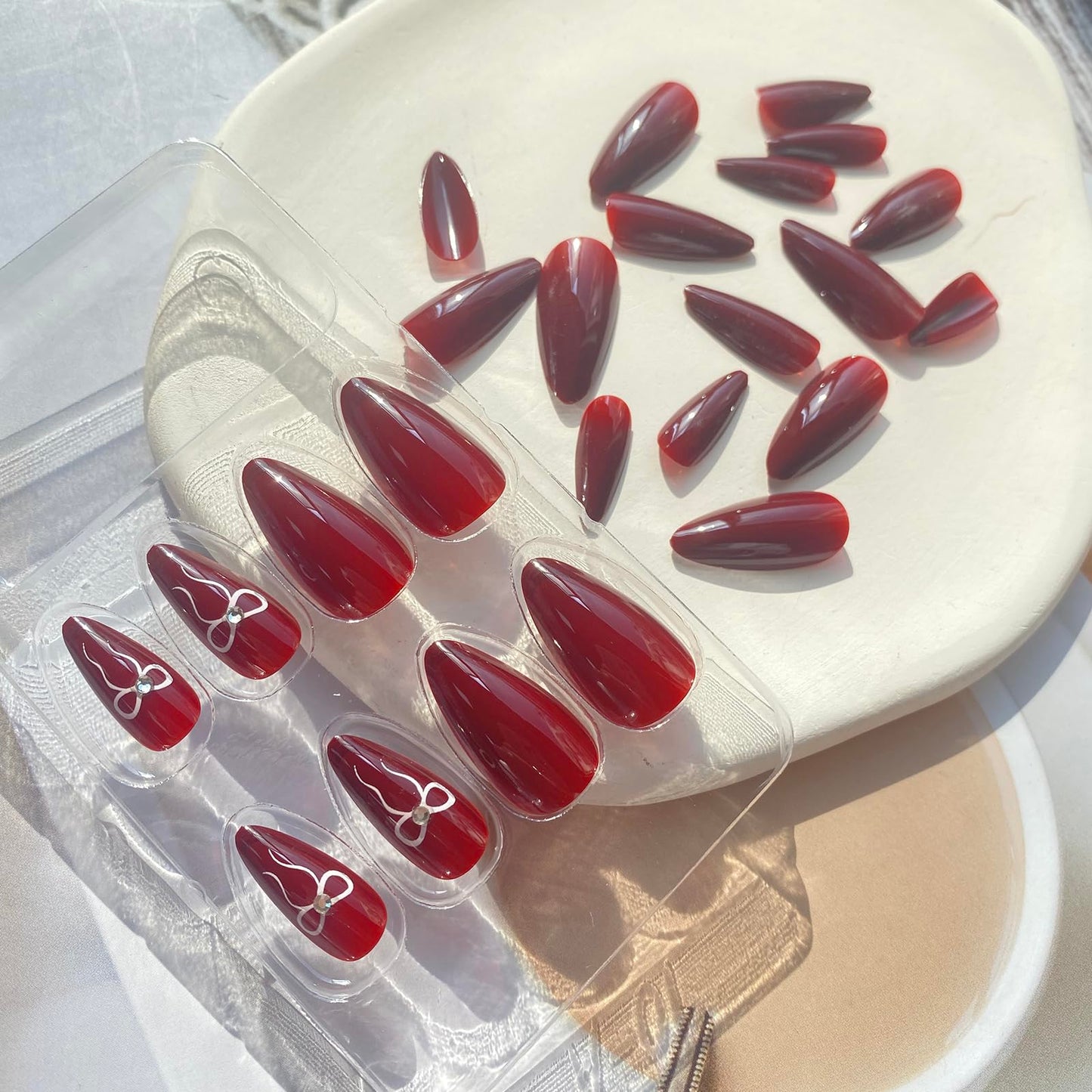 Burgundy Press on Nails Medium Almond - UCCASA Winter Almond Fake Nails Press ons Solid Color with Bow Design Full Cover False Nails Glue on Nails Stick on Nails Artificial Acrylic Nail Art Kit 24 Pcs