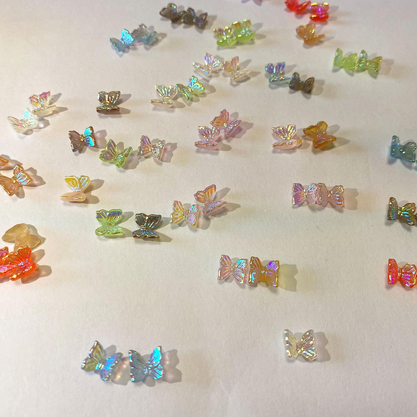 QZRUO 60Pcs Butterfly Nail Charms - Clear Small Cute and Glittery 3D Acrylic Gems for Stunning Nail Art