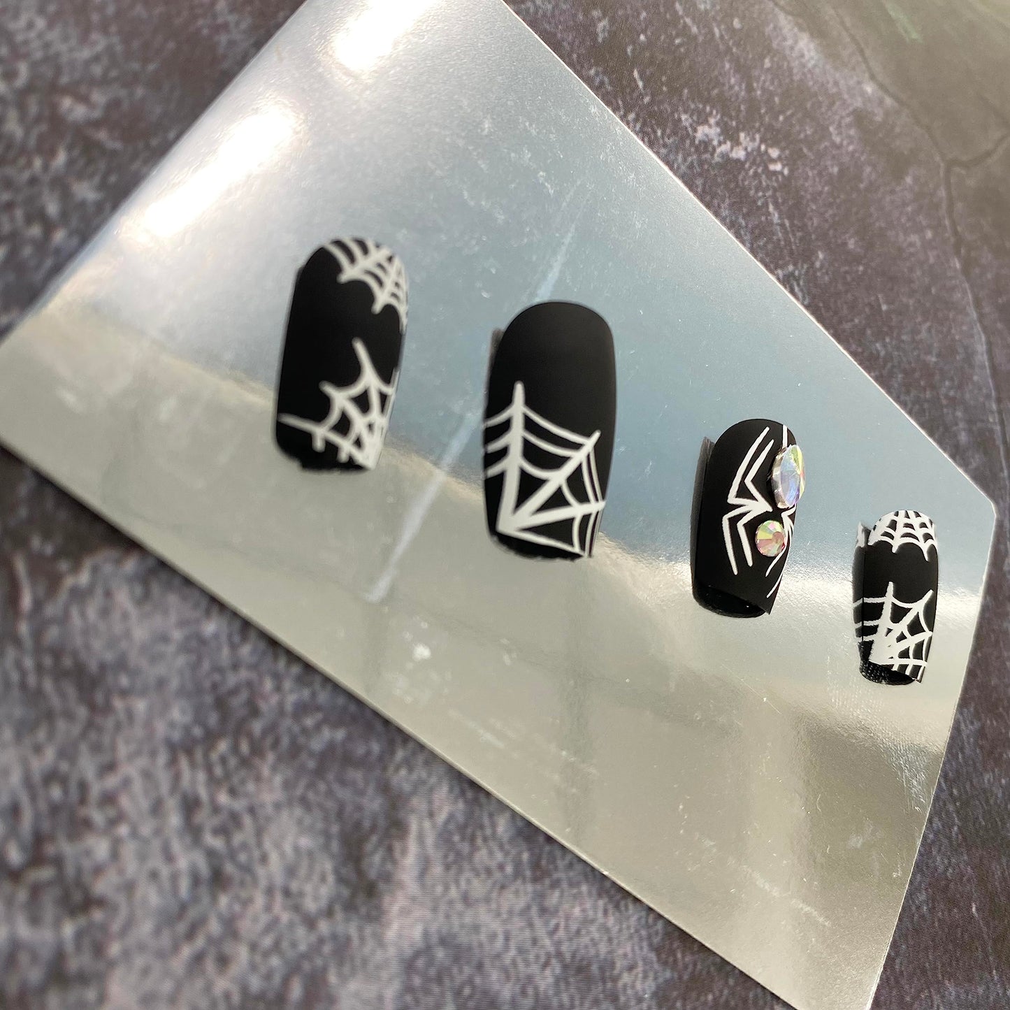 Halloween Press on Nails Medium False Nails with White Spider Web Rhinestones Designs Full Cover Black Acrylic Nails Matte Fake Nails with Nail Glue for Women Girls Nails Supplies