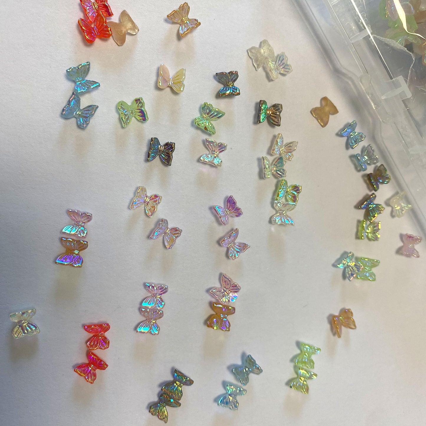 QZRUO 60Pcs Butterfly Nail Charms - Clear Small Cute and Glittery 3D Acrylic Gems for Stunning Nail Art